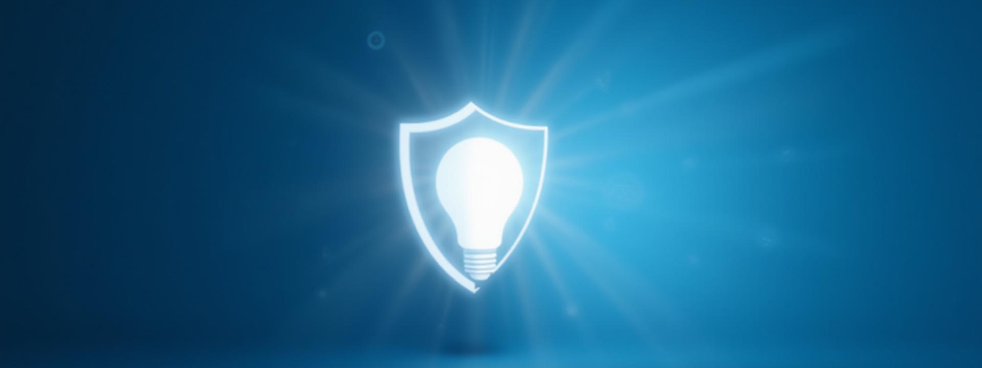光る電球と盾の抽象的な組み合わせが、アイデアの保護と革新的なビジネス戦略を象徴しています。